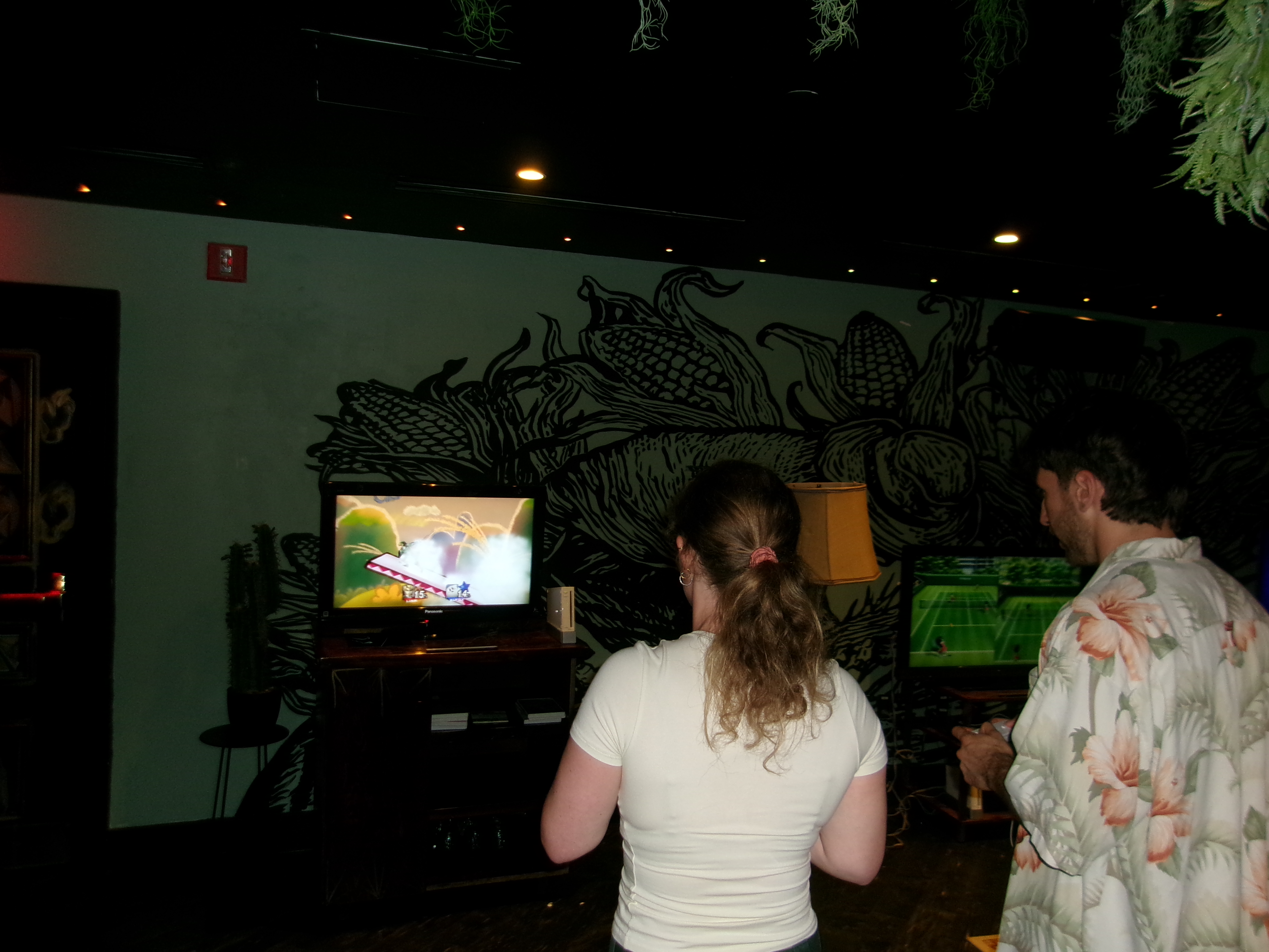 Two guests playing Super Smash Bros. at Reset